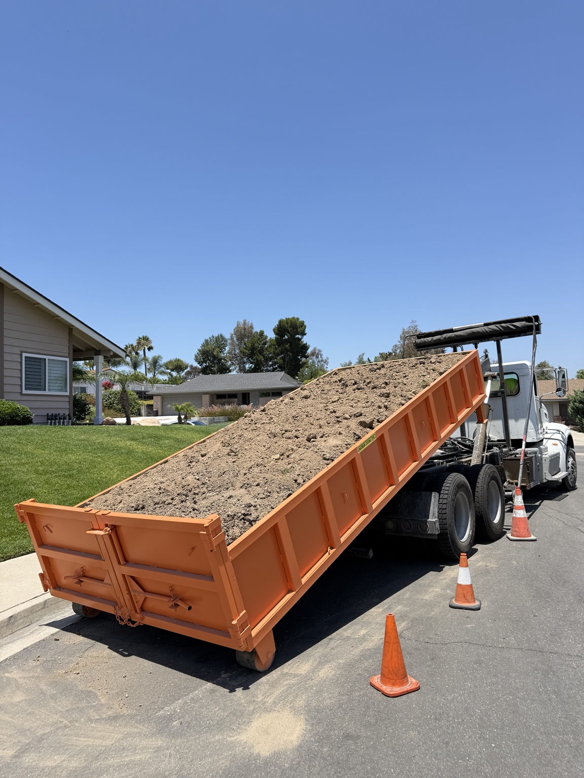 CM DUMPSTERS hauling dirt