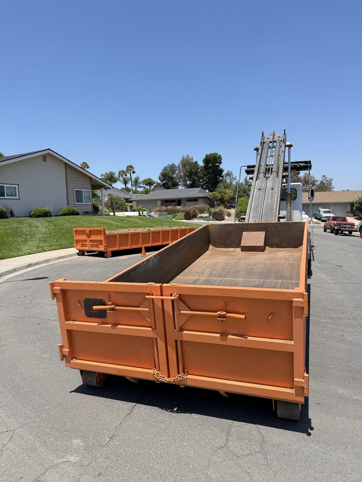 Empty roll-off dumpster
